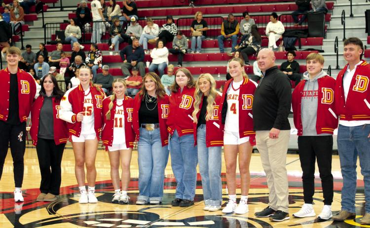 Dale held their academic letter jacket ceremony on Dec. 3 before their home basketball games. The jackets are earned by those making a 4.0 GPA or more, and they were paid for by BancFirst. Shown, from left, are Trayden Chambers, Scarlett Barnell, Teague Muncy, Kinsley Hill, Poppy Robinson, Eryn Woolridge, Macy Herman, Ava Bell, Ava’s father and BancFirst President Casey Bell, Levi Kelly and Jack Rooker. Countywide &amp; Sun/Natasha Dunagan