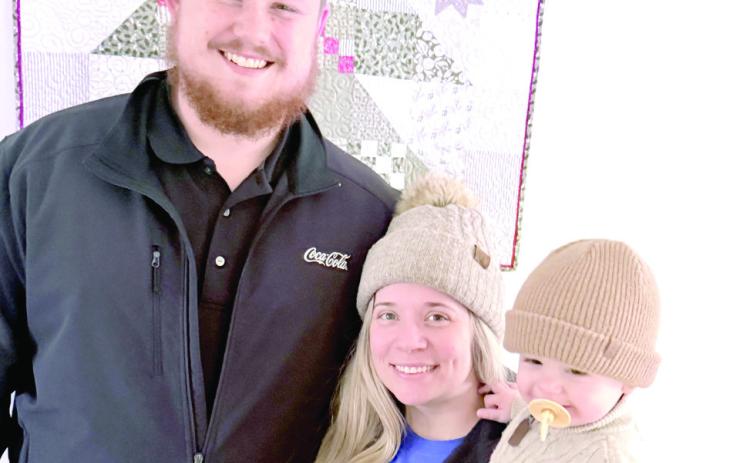 Tristan Wyatt poses with his wife, Bailey and son William.