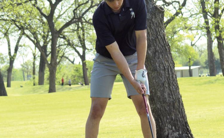 Shawnee senior Gage Lomeli prepares for a drive at FireLake Golf Course during the Tecumseh Boys Golf Tournament on April 9.