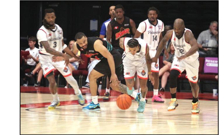 Potawatomi Fire Guard Chuck Guy steals the ball from former teammate Deshawn Munson in the second game against 4 Bears Roar during the West Regional Championship, held at FireLake Arena on June 14. In this game, Guy achieved his 11th double-double with 21 points, 11 assists, seven rebounds and four steals, according to potawatomifire.com. Also shown, from left, are Ricky Artis II, Jahmal Me Murray, and Willie Warren. The Fire won both games and advance for the fourth year to the TBL Finals June 18 at 7.