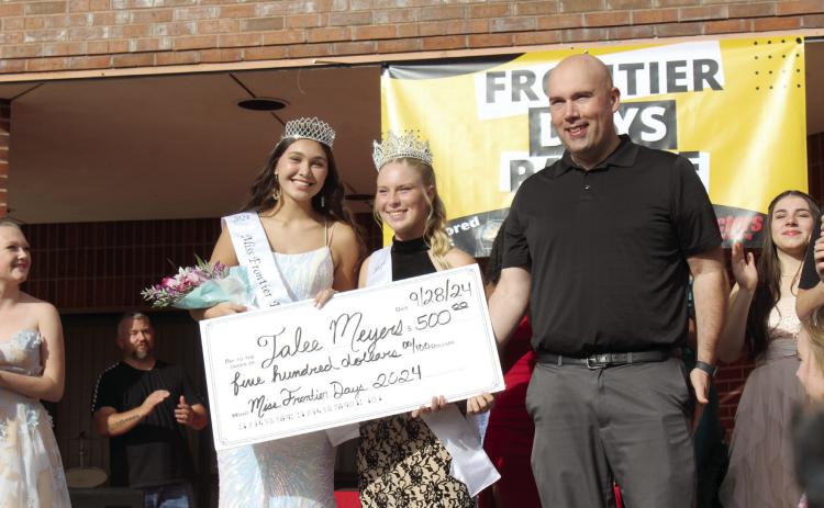 Jalee Meyers was crowned Miss Frontier Days and received a $500 scholarship check from the Tecumseh Chamber of Commerce, presented by the pageant’s premiere sponsor Tecumseh Public Schools on Sept. 28. Shown, from left, are Meyers, 2023 Miss Frontier Days Aleigha McCullough, and TPS Superintendent Robert Kinsey. Countywide & Sun/Natasha Dunagan