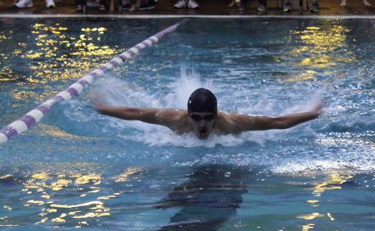 Shawnee senior Vincent Tash competes in the Boys 100 Yard Butterfly during the swim meet with Moore, Southmoore and Westmoore athletes on Nov. 10 at the Shawnee YMCA. Tash placed fourth in the event with a 1:07.90. His teammate and fellow senior Ethan Oller placed first with a 55.84. Shawnee placed first in the Combined Team Scores, with 803 points. They had 416 points for the women and 387 points for the men. Countywide &amp; Sun/Natasha Dunagan