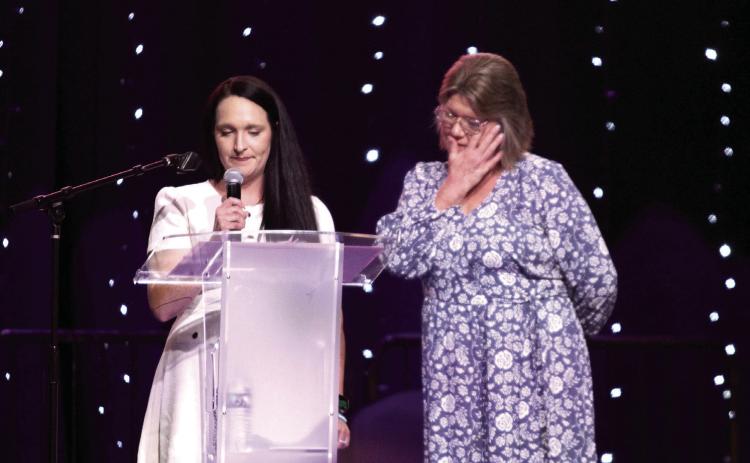 Bridget Saunders, right, wipes away a tear as her daughter Ashton Stiles tells about her experiences trying to escape from a violent man at the Project: SAFE 16th Annual Honey Do Auction on Oct. 3. Project: SAFE helped 1,984 clients in 2023, 86 percent of which were women. Countywide & Sun/Natasha Dunagan