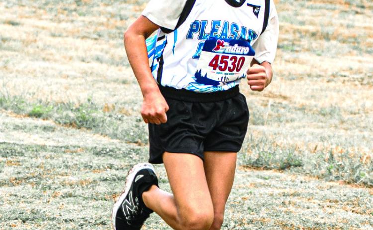 Kamryn Hobia, a 6th-grader at Pleasant Grove - Shawnee, competed in the Oklahoma Rural Elementary School Division II State Cross Country Meet on Oct 3, 2026. She ran most of the race with one shoe, losing the other shortly after the race began. She finished in first place with a time of 9:46:18, competing against 6th-8th-graders across the state. Photo provided by Adriel Clements Media