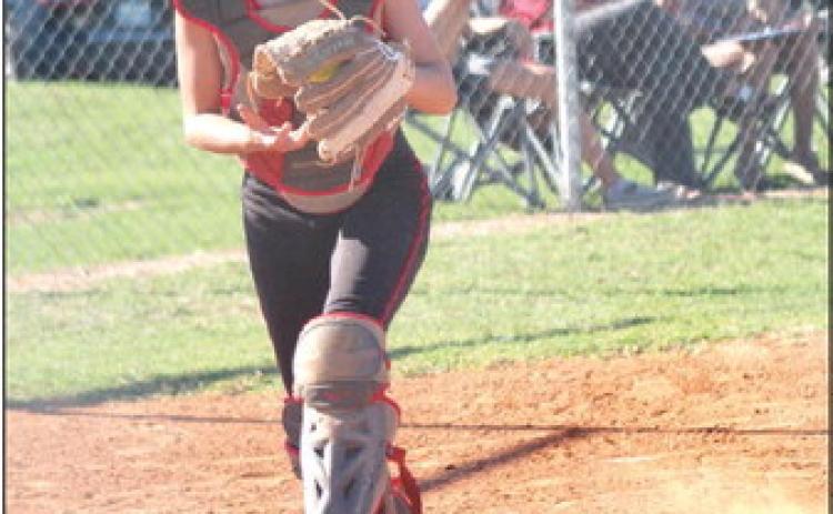 Macomb senior Arie Hazell kicks up dust as she goes to return the ball to the pitcher in the home game against Sasakwa on Sept. 12. Sasakwa won 8-1. Countywide &amp; Sun/Natasha Dunagan