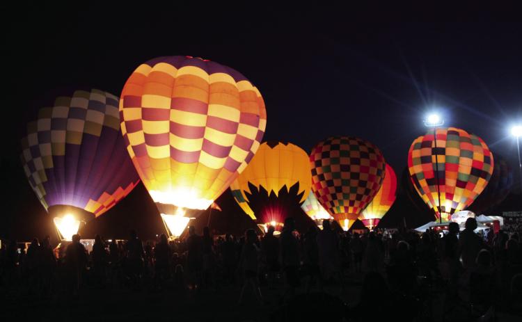 A record number of people attended the Fifth Annual FireLake Fireflight Balloon Festival on Aug. 12-13. There were 25 hot-air balloons from seven states that participated in balloon launches, tethered rides, and balloon glows, such as this one on Sat. night. Countywide & Sun/Natasha Dunagan