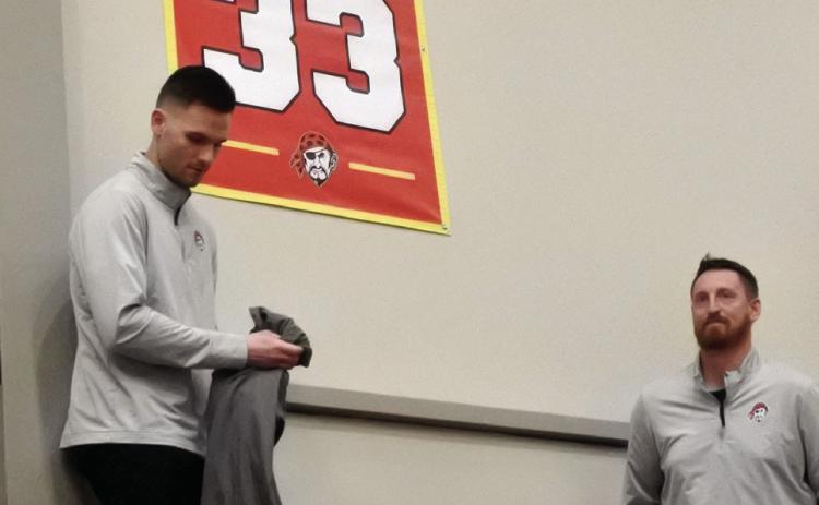 The retired #33 is revealed to the crowd.