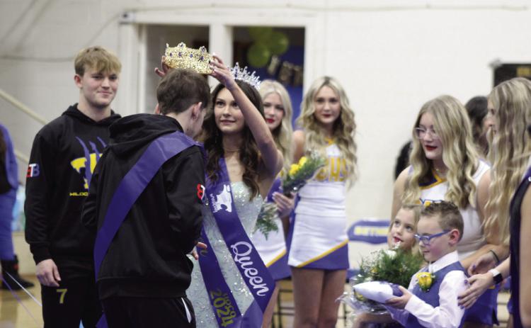 Bethel Homecoming Wrestling Queen Chloe Epperley crowns Blake Griffith as King during the ceremonies on Jan. 25, as flower girl Laynie Peltier and crown bearer Remington Hayes look on. Countywide & Sun/Natasha Dunagan