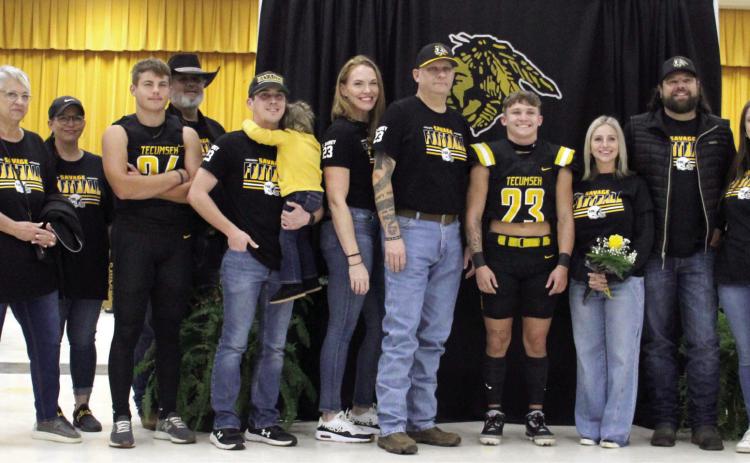 Tecumseh High School held their Senior Night ceremonies for football, cheer, band and cross country in the W.P. Wood/THS Alumni Center on Nov. 8, before the home football game. Shown are Zant Shirey (#23), his family, including his cousin sophomore Kruz Shirey (#24), and Head Football Coach Ty Bullock, far right. Photo provided by Tracey Forrester.