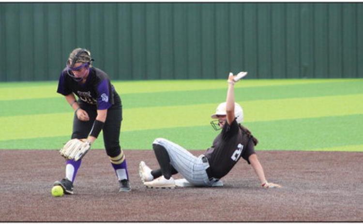 Tecumseh freshman Madison Gray slides into second base as the Red Oak player drops the ball during the Dale Festival on Sept. 15. The two-day tournament was held at FireLake Ball Fields and the Lady Savages won both their games. Countywide &amp; Sun/Natasha Dunagan