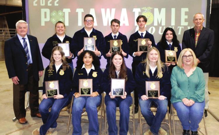 Recipients of the Gordon Richards, Sr., Achievement Award from left to right seated are Katelyn Fleming, Tecumseh, Paige Smith, McLoud, Cora Bender, Dale, Allie Brown, Asher and Jamie Barrick of The Clinic Pharmacy. Standing from left to right are Gordon Richards, Jr., son of the founder of the award, Macy Nelson, Shawnee, Cooper Kline, North Rock Creek, Nate Stephenson, Bethel, Kade Miller, Macomb, Chisam Schiller, Wanette and Tim Barrick of the The Clinic Pharmacy.