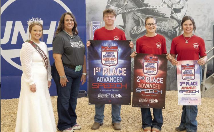 Incoming Tecumseh senior Taylor Marrs poses with his first-place banner for Advanced Speech in the Intermediate Division during the Junior National Hereford Exposition on July 7. Ella Bane, of Towanda, IL, won second place, and Josie Mares, of Glenrock, WY, won third place. Photo provided