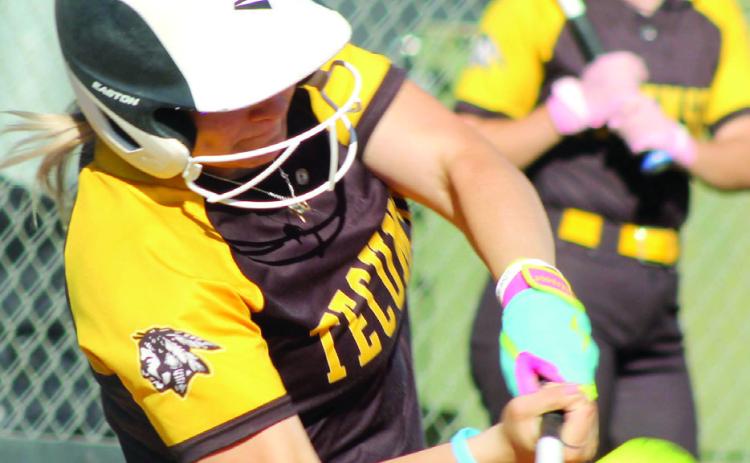 Tecumseh senior Steeli Mitchell smacks a single during the second inning of the home game against McLoud on April 7. The Lady Savages won 2-0. Natasha Dunagan, Countywide &amp; Sun