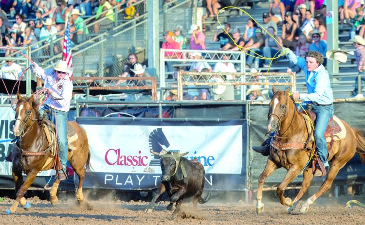 Landen and Hayden Youngblood, of Shawnee, work together in the team roping at their first International Finals Youth Rodeo on the evening of July 10. Photo courtesy of Richelle Treece.