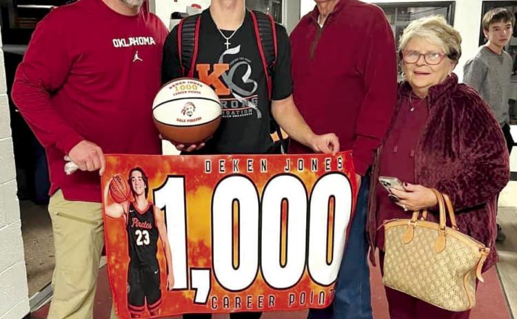 Dale senior Deken Jones reached 1,000 career points during the basketball game at Luther on Dec. 12. Shown, from left, are his father Derek Jones, Jones, grandfather retired Coach Harold Jones and grandmother Vicki Jones. Photo provided.