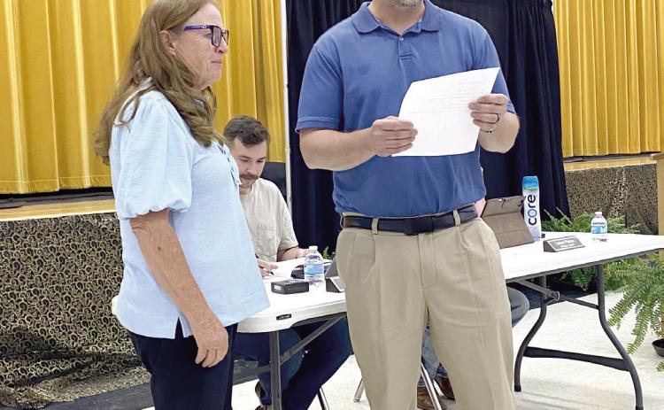 Board President, Iva Bingham swears in Stephen Kingham to fill the last open (Ward 4) seat at the May Tecumseh School Board meeting. Julie Talton, Countywide &amp; Sun
