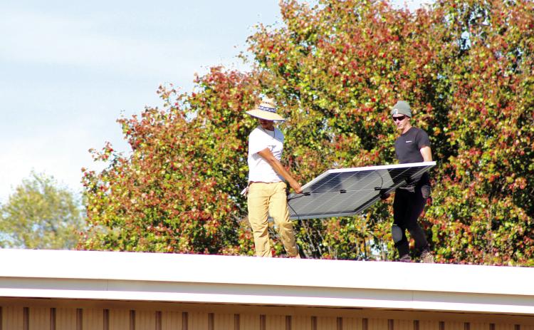 The crew of EightTwenty Solar work on installing 42 solar panels on the Earlsboro Elementary School building on Nov. 6. Principal Stacey Barton said he worked with OG&E through the CLEAResult Program to make this happen. They were on a waiting list for the past five years. Countywide & Sun/Natasha Dunagan