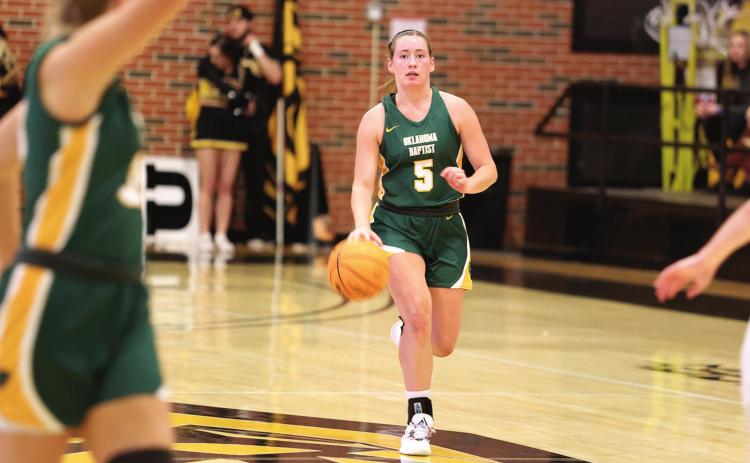 Mallory Lockhart drives down court during recent action against Cameron. Photo provided by OBU
