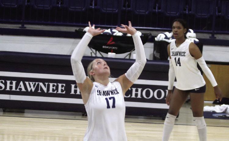 Shawnee junior Molly Megehee serves as the setter with an assist during a home match on Aug. 27, as Janya Bruner looks on. Natasha Dunagan, Countywide &amp; Sun