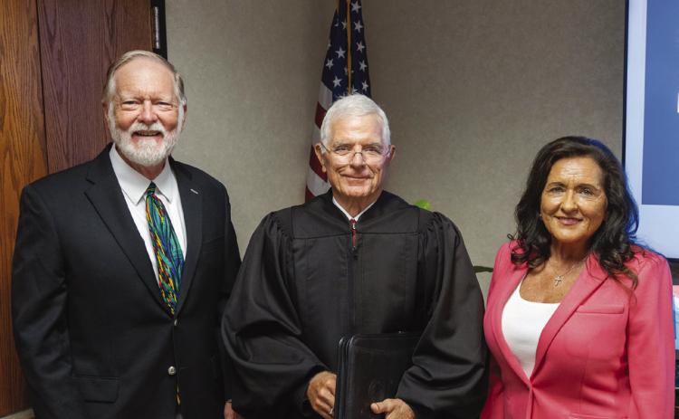 Barry Tims (left) and Mona Adkisson (right) were sworn in at the July 17 meeting of the SSC Board of Regents. Former District Judge George Butner (center) administered the Oath of Office. Photo Provided