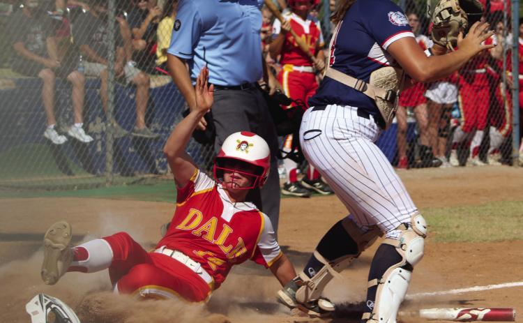 Dale junior Karsen Griggs slides into home, as the Minco catcher waits for the throw, during the third inning of the State Quarterfinal game on Oct. 6 at the USA Softball Hall of Fame Stadium in OKC. The Lady Pirates played a hard-fought game the whole seven innings and won, 3-2. They went on to the Semifinals with Pocola, but lost 2-6.