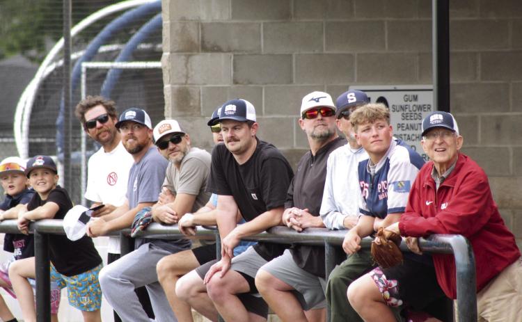 Shawnee baseball alumni watch the ball from their dugout during the SHS Alumni Game on April 25. Alumni, from left, are Tommy Smith, Bryce Holland, Jeff Cannon, Matt Bowlan, Tanner Sparks, Justin Harder, Russ Oliver, Owen Oliver and Bill Ford. Photos by Natasha Dunagan, Countywide & Sun