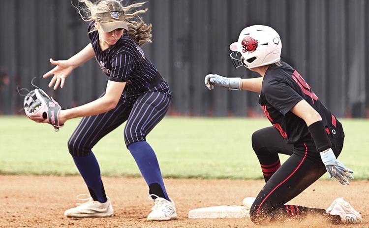 North Rock Creek's Sophie Morris beats the throw at 2nd against Bethel in the McLoud Tournament on Sept. 5. NRC beat Stroud 13-1 and Bethel 6-3 to advance to the gold bracket.