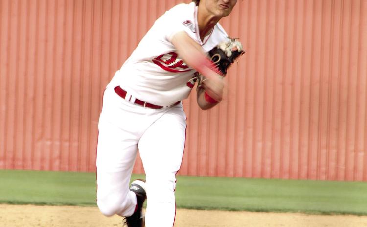 Dale sophomore Cruz Garrett slings the ball past the Jones batter at the April 17 home game. Photos by Natasha Dunagan, Countywide & Sun
