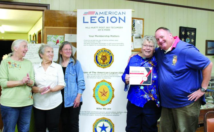 Norman Veterans Center Recreation Coordinator Darold Lairson, far right, presents American Legion Post #260 Auxiliary President Donna Snodgrass with a belated certificate for Volunteer Appreciation Week on May 8. The Tecumseh American Legion Auxiliary members have hosted the Norman veterans for bingo each month for at least 30 years, said Lairson.