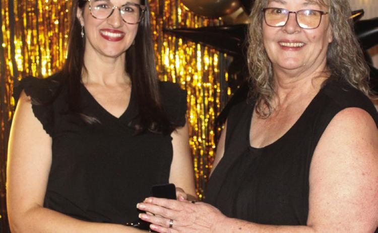 Countywide & Sun Owner and Publisher Suzie Campbell, right, presents Lacey Holt with her Pottawatomie Power Poll Top 10 lapel pin during the Awards Gala on Oct. 24. Holt tied with Michael Affentranger for 10th place. Natasha Dunagan, Countywide &amp; Sun