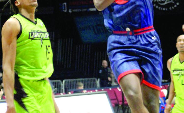 Potawatomi Fire Guard & Forward Theo Johnson puts up a shot in the fourth quarter of the home game with the Little Rock Lightning on March 25. The Fire won, 122-96. Countywide &amp; Sun/Natasha Dunagan