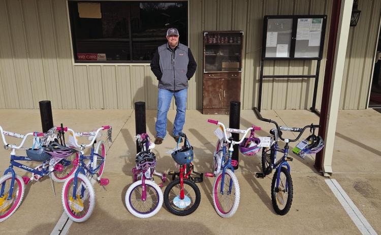 This holiday season, OG&E is donating 330 bikes to children in communities across its service area in Oklahoma – including in Earlsboro and Asher. Josh “Dude” Robertson from OG&E’s Shawnee Service Center delivers bicycles to the Earlsboro Town Hall. Thanks to the electric company’s generous donation, many children in both Earlsboro and Asher received a new bike just in time for the holiday season. Photo provided by OG&E
