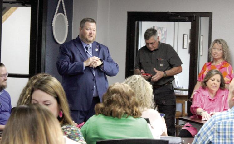 New Shawnee Public Schools Superintendent Dr. Jason James speaks with a room full of faculty and staff during the meet-and-greet held after the SPS Board of Education Special Session in which he was hired on April 22. Board President Clif Harden said James will begin consulting on April 24, and his contract will begin on June 2. Natasha Dunagan, Countywide & Sun