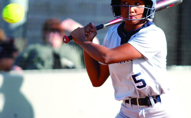 Shawnee’s Amiyah Briones keeps her eye on the ball before hitting a single in the second inning of the home game with Seminole on Oct. 1. The Lady Wolves Fast-Pitch team won, 12-0. Countywide & Sun/Natasha Dunagan