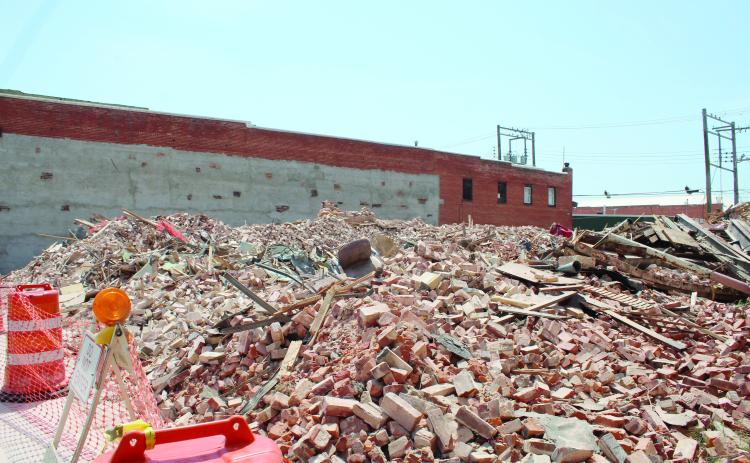 An office chair remains in the rubble which was once Pott. County Book & Office Supply at 109 E. Main in Shawnee. The building had its western wall blown out during the April 19 tornadoes. Then, its roof collapsed on July 3, and after closing that block, the city demolished the 116-year-old former Kress’s building on July 21. Pott. County Book & Office Supply had been in the building since 1983, and owner Terry Webb said, at this time, he doubts they will rebuild. Countywide & Sun/Natasha Dunagan
