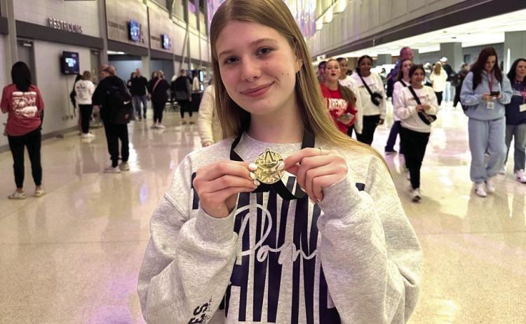 Shawnee senior Senior Mia Bryant shows off her hardware. Photo provided by SPS