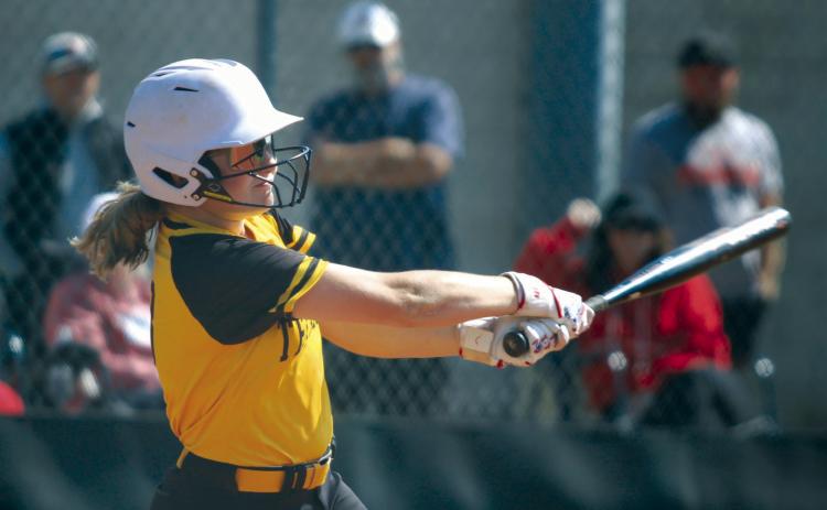 Tecumseh sophomore Josie Walker hits a single in the sixth inning, which drives in two runs, during the Dale-Tecumseh Tournament game against Prague held at Tecumseh on Sept. 7. The Lady Savages won that game, 4-0, and they only lost one out of five games over the three-day tourney. Countywide & Sun/Natasha Dunagan