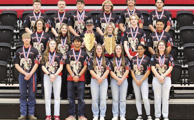 Photo Provided. North Rock Creek Archery Back-to-Back State Champions: Varsity Compound Team Front Row: Caid Wiles, KK Munn, Eli Dragman, Makenna Rudek, Makayla Rudek, Angela Rodea, Courtney Grace. Middle Row: Austin Wilkins, Kendal Smiley, Caleb Cahall, Madison Neer, Tristen Munn, Greyson Sharma Back Row: Tatum Manning-Smith, Joel Riley, Braden Ueltzen, Brayson Searcy, Landon Kelough, Joel Vincent.