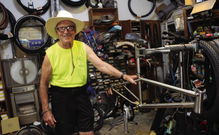 Larry Smith, owner of The Bicycle Shoppe in Shawnee, poses by the bicycle he designed in memory of BMX racer Rodney Cooper for Cooper’s sister Cindy Parsons. Cooper and Parsons will be inducted into the Oklahoma BMX Hall of Fame, in Tulsa, on Oct. 12. Smith was inducted in 2022 in the Industry category. Countywide & Sun/Natasha Dunagan