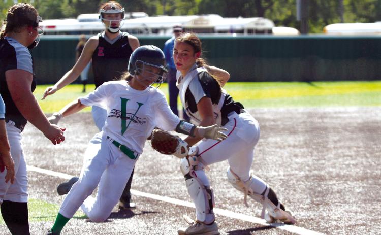 Earlsboro catcher Lilly Gentry tries to tag a Varnum runner before they reach home during the third inning of the Aug. 17 Varnum game. The Lady Wildcats won against Varnum, 8-4, at the Little River Conference Fast-Pitch Tournament. On Aug. 15, they beat Paden, 13-1, and lost to Strother, 2-9. They won over Sasakwa, 16-1, on Aug. 16, and they lost to Macomb, 3-8, on Aug. 17.