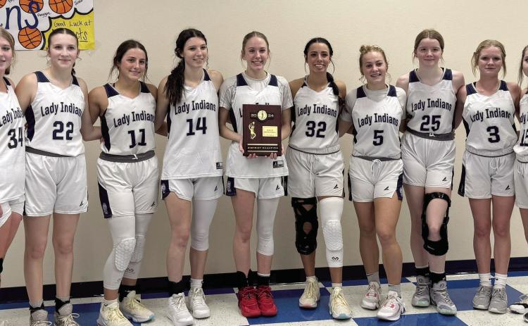 The Asher Lady Indians pose with their District Championship plaque after beating Legacy Christian 45-14 in the finals on Saturday, Feb. 10. Photo provided