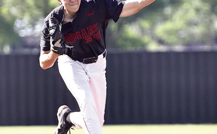 North Rock Creek's senior Cason Coomer hurls the ball across home plate. Photo courtesy of Gowin Photography