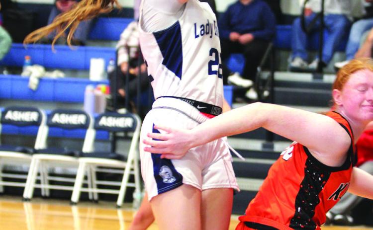 Asher's Makenah Templeton grabs the rebound and aims for the bucket just before the end of the Jan. 3 home game against Konawa. The Lady Indians won 65-37, according to ossaarankings.com.