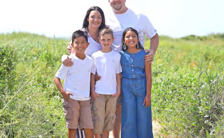 Kaycee and David Koonce pose with their children pictured from left, Troy, Nathaniel, and London.