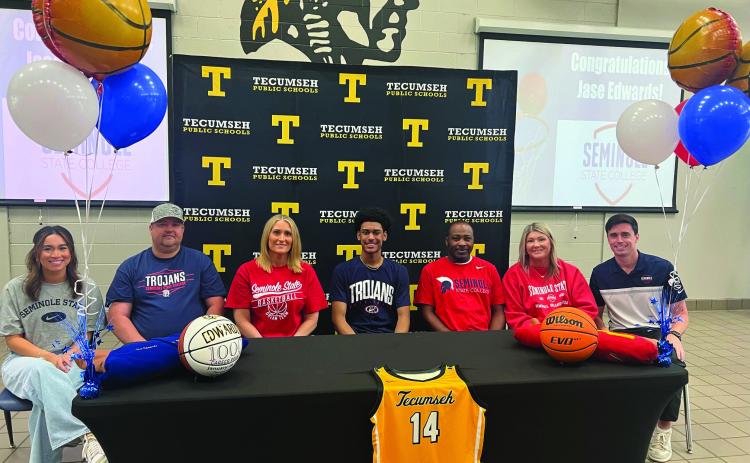 Tecumseh senior Jase Edwards signed a letter of intent in basketball for Seminole State College on May 6. Shown, from left, is Jayden Edwards, sister; Joe Hooser, stepfather; Sarah Hooser, mother; Edwards; Tecumseh Head Boys Basketball Coach Bryant Edwards, father; Michelle Edwards, stepmother; and Lucas Hunter, SSC head coach. Photo provided.