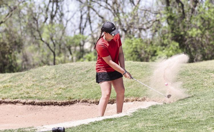 North Rock Creek's Robyn Click gets out of the sand. She shot her personal best with an 85. Photo courtesy of Gowin Photography