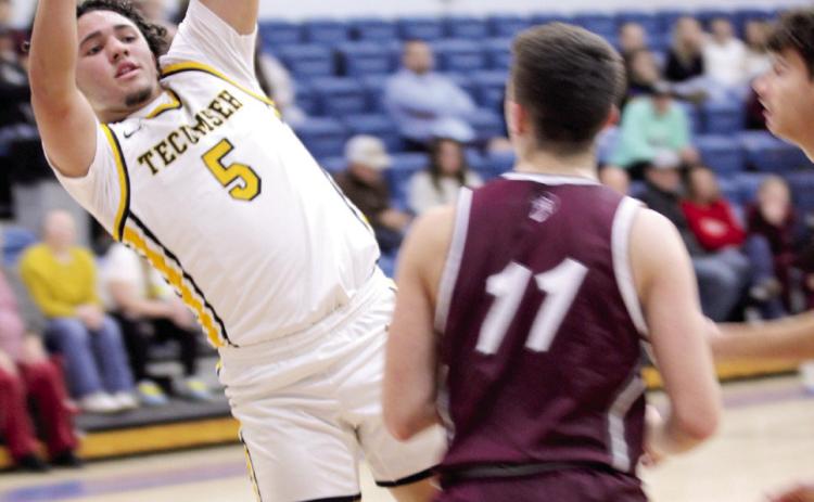 Tecumseh senior Aveon Stokes passes to a teammate during the Dec. 11 game against Eufaula in the Bethel First United Basketball Classic. The Savages edged Eufaula, 61-59; lost to Blanchard 46-67; and fell to McLoud, 55-56, in the consolation round of the threeday tournament. Natasha Dunagan, Countywide &amp; Sun