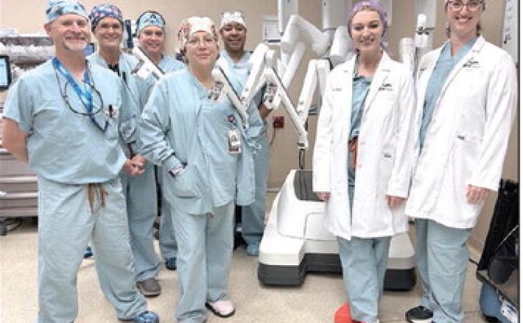 Robot Team in Shawnee: Dr. Amanda Schovanec and Dr. Danielle Manship (at right in lab coats) and the robotic surgical team at SSM Health St. Anthony Hospital – Shawnee. Photo provided by SSM