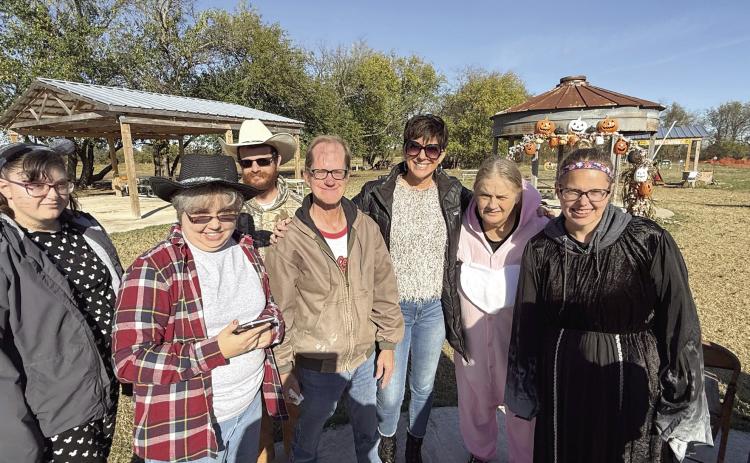 South Central Industries CEO Tina Hanna (third from right), poses with some of her PEEPs, or clients, during a recent event. Photo provided