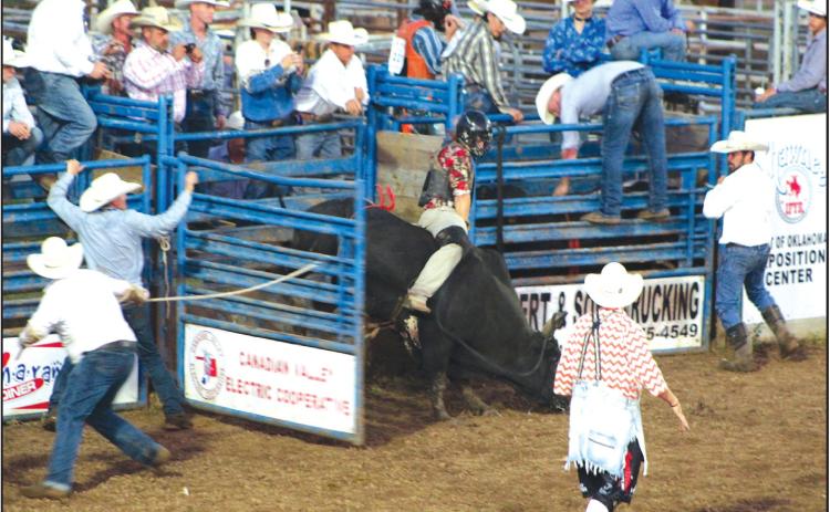 Brayden Dowdle of McLoud competes in the second round of bull riding at the IFYR on July 12. Countywide & Sun/Natasha Dunagan